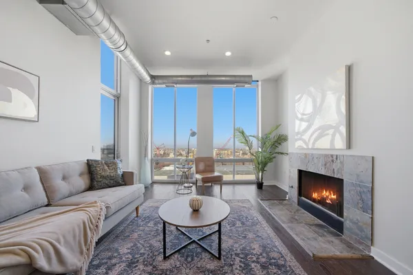 a living room with furniture and a fireplace