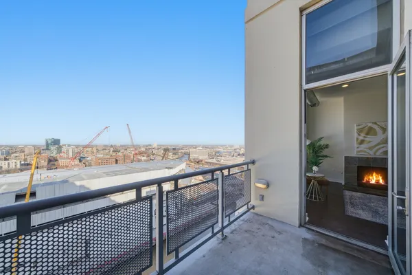 a view of a balcony and a kitchen