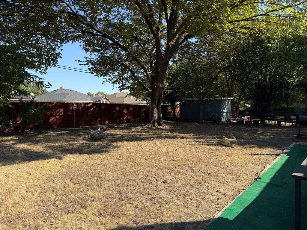 1535 Clearbrook Street Lancaster, TX 75134 - Photo 12 of 15 a view of swimming pool with a yard