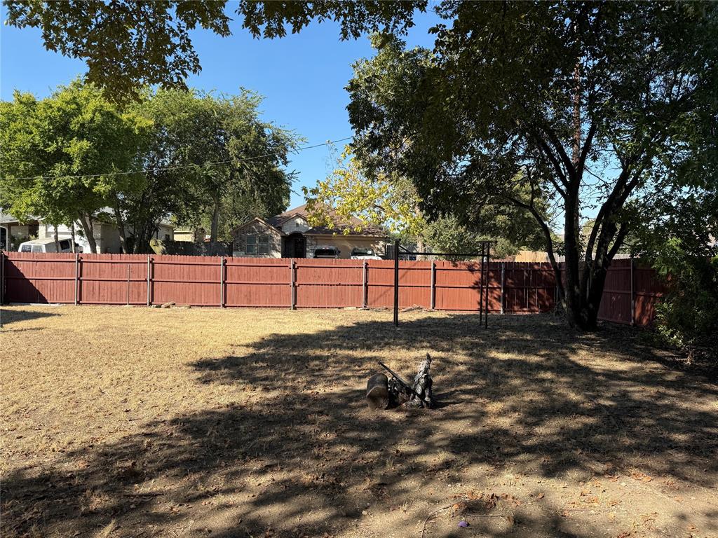 1535 Clearbrook Street Lancaster, TX 75134 - Photo 13 of 15 a view of a yard with trees