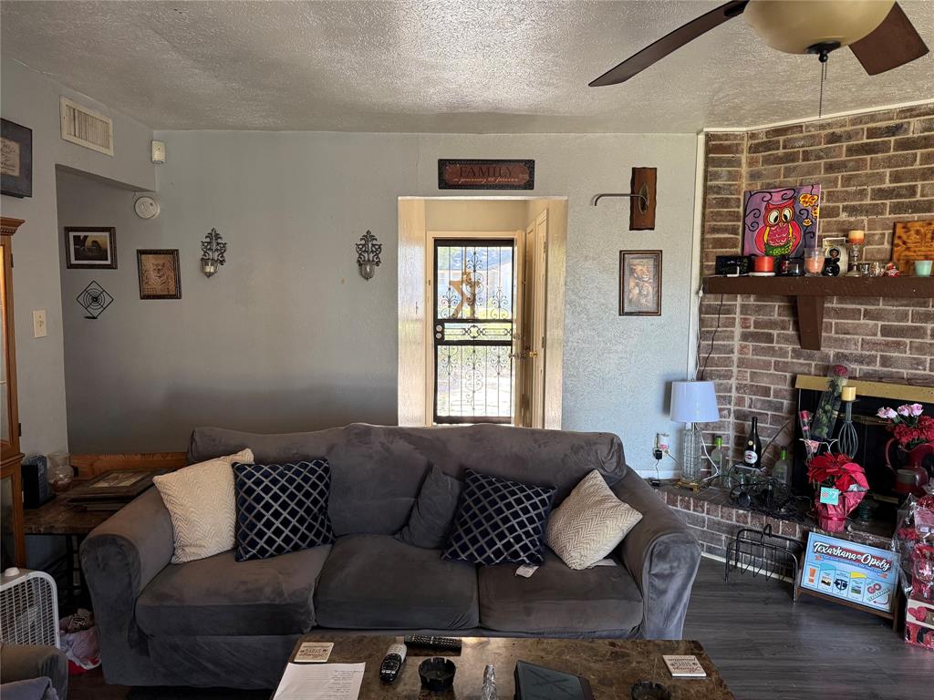 1535 Clearbrook Street Lancaster, TX 75134 - Photo 6 of 15 a living room with furniture and a fireplace