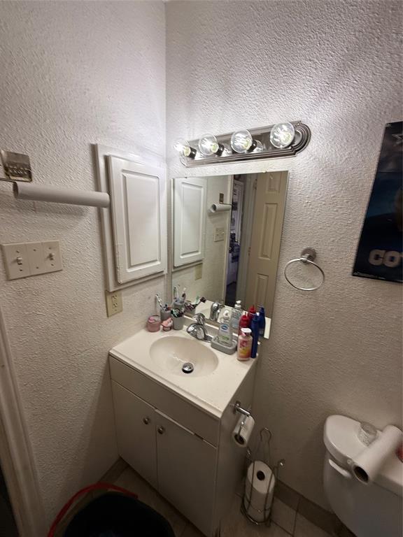 1535 Clearbrook Street Lancaster, TX 75134 - Photo 10 of 15 a bathroom with a sink mirror and toilet