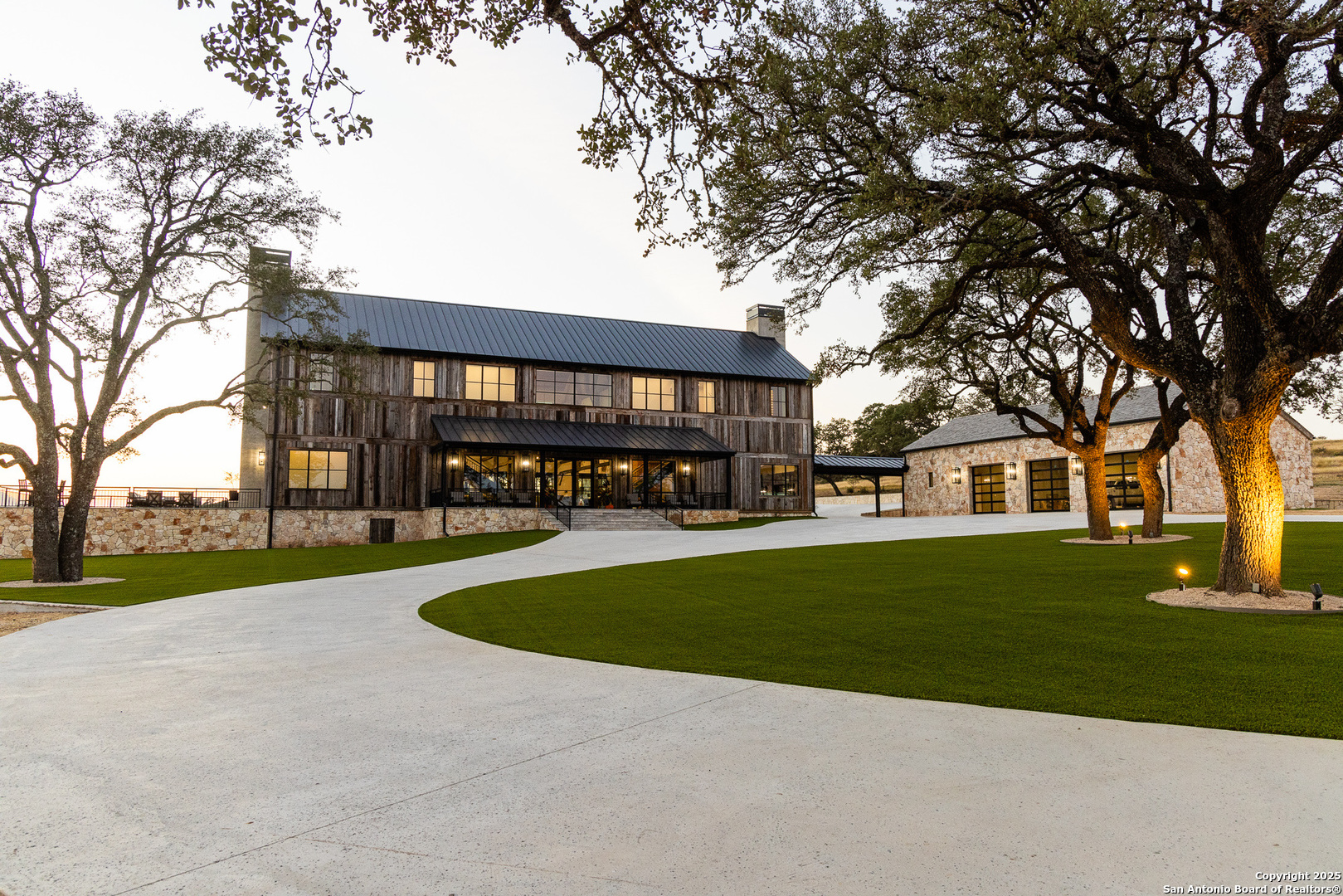 a view of a house with a yard and tree s