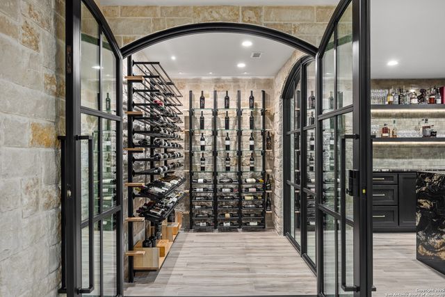 a bedroom with a large bed and a flat screen tv