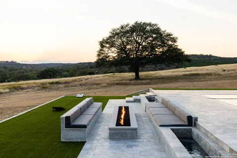 a front view of a large building with swimming pool