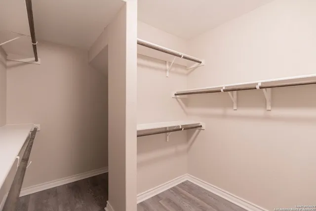 a view of an empty walk in closet