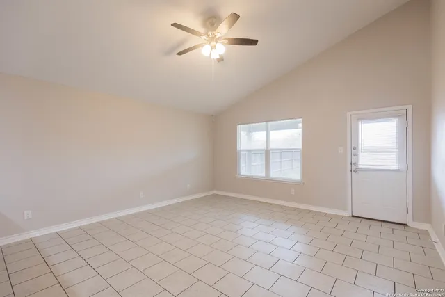 a view of an empty room with a window