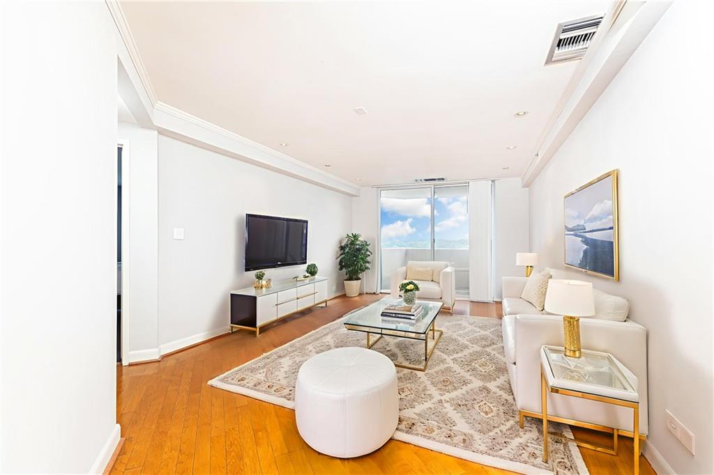 1501 Clairmont Road, Unit 1525 Decatur, GA 30033 - Photo 4 of 26 a living room with furniture and a flat screen tv