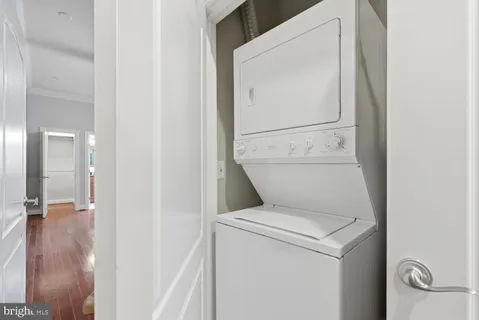 a bathroom with a toilet and a mirror