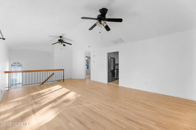 a view of an empty room and a window