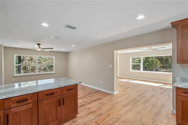 a view of a kitchen with a large window