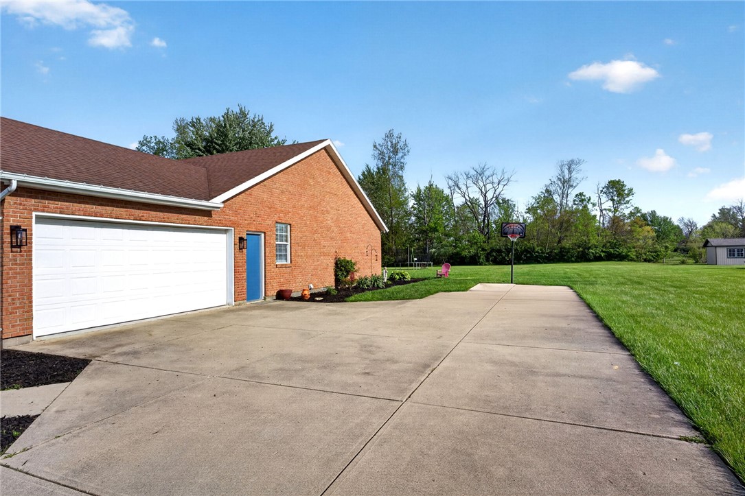 4996 Shannon Avenue Springfield, OH 45504 - Photo 50 of 61 This property features a spacious garage, ample outdoor space, and a well-maintained exterior.