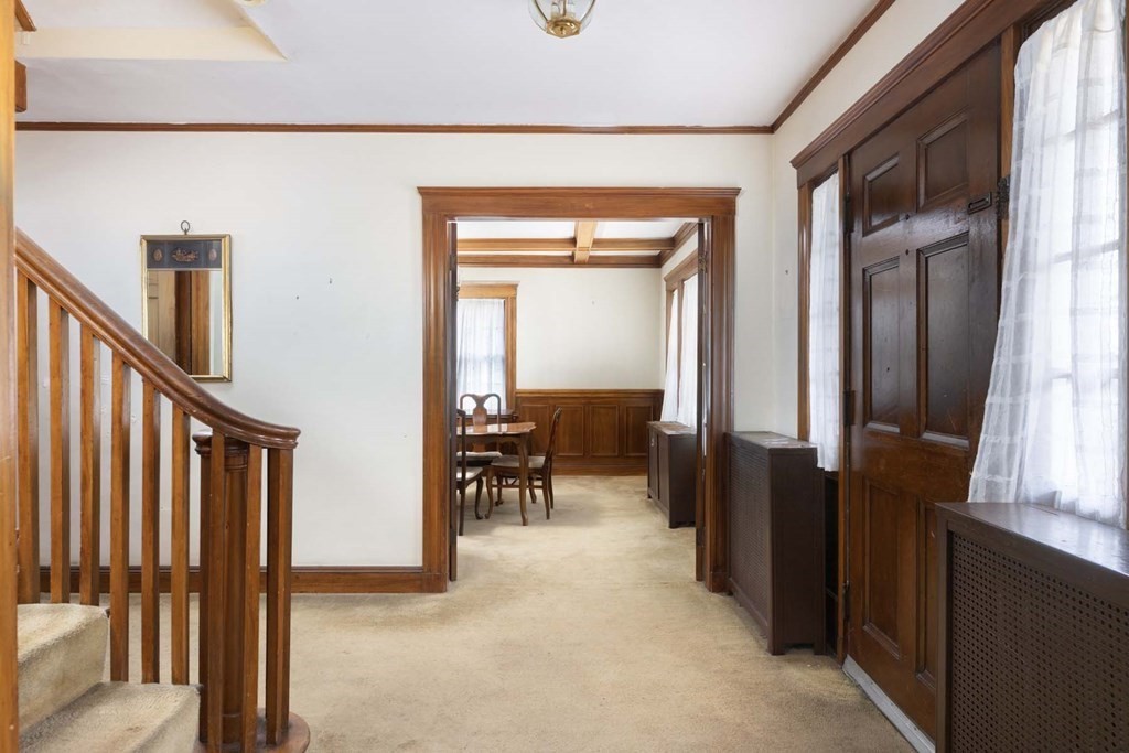 37 Wolcott Road Brookline, MA 02467 - Photo 2 of 12 a view of a hallway with living room and utility room