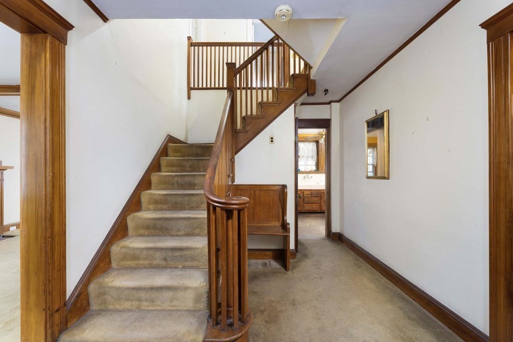 37 Wolcott Road Brookline, MA 02467 - Photo 3 of 12 a view of entryway and hall with wooden floor