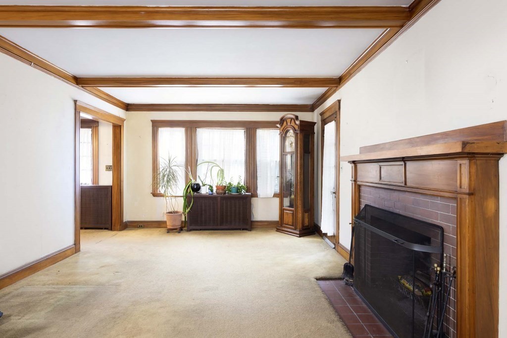 37 Wolcott Road Brookline, MA 02467 - Photo 5 of 12 a view of livingroom with furniture and fireplace