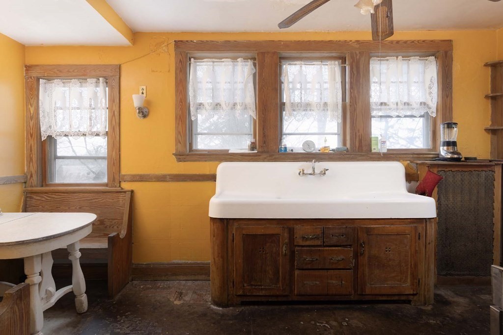 37 Wolcott Road Brookline, MA 02467 - Photo 7 of 12 a bathroom with a sink a bathtub and next to a window