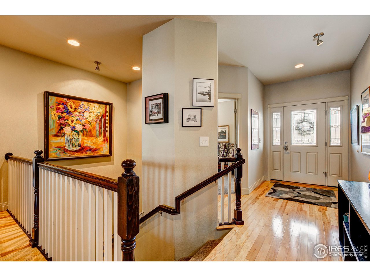6001 Bay Meadows Drive Windsor, CO 80550 - Photo 11 of 39 Dramatic Foyer with Hickory Wood Floors