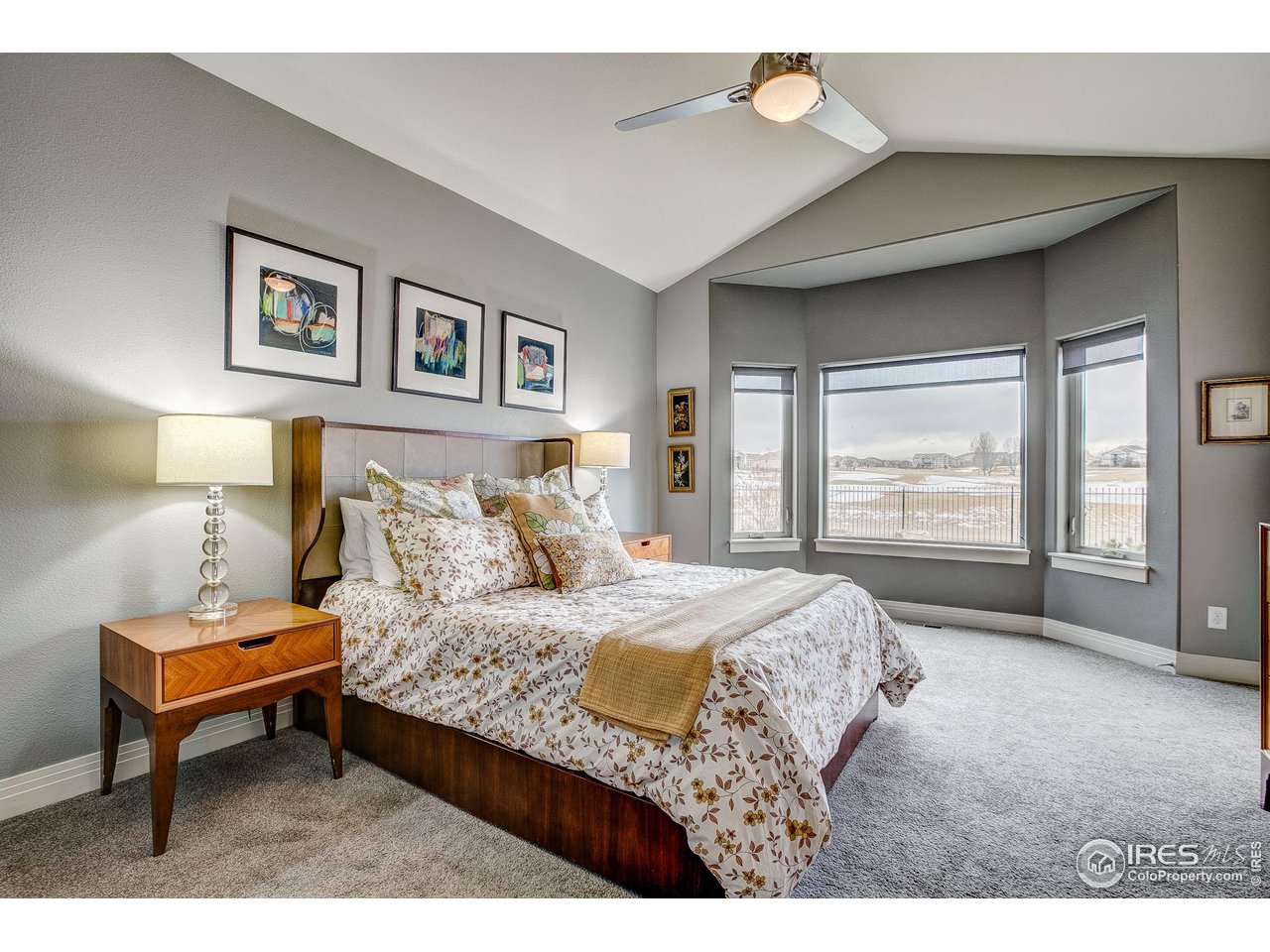 6001 Bay Meadows Drive Windsor, CO 80550 - Photo 20 of 39 Vaulted Primary Bedroom with Bay Window, Access to the Patio and Mountain Views!