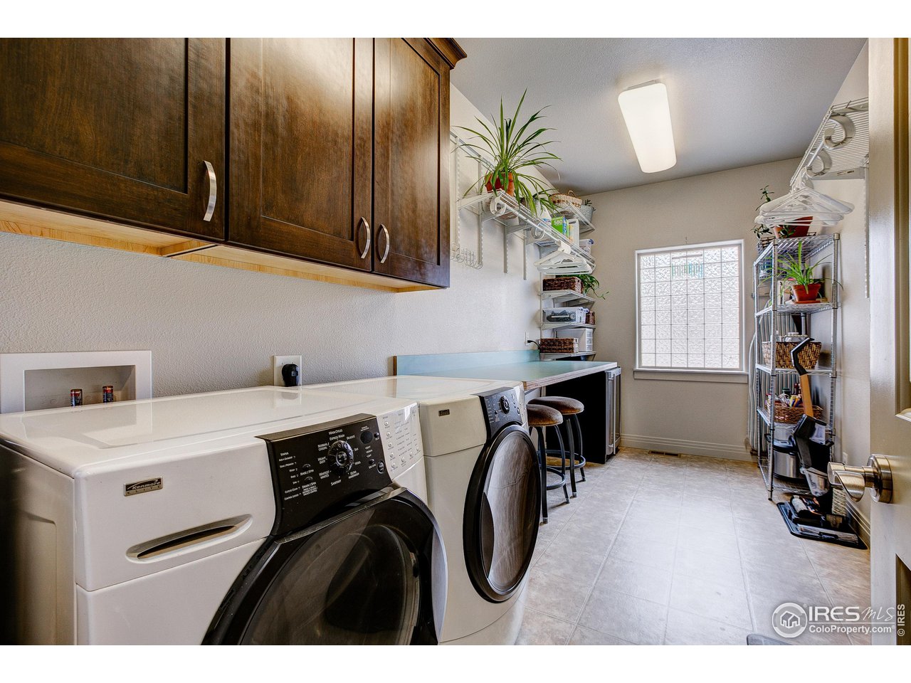 6001 Bay Meadows Drive Windsor, CO 80550 - Photo 25 of 39 HUGE Laundry/Mud Room with Utility Sink for all your projects.