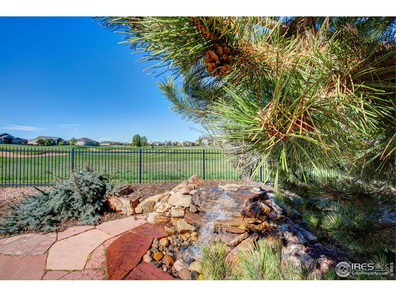 6001 Bay Meadows Drive Windsor, CO 80550 - Photo 4 of 39 Enjoy the sounds of a Mountain Stream in your backyard!