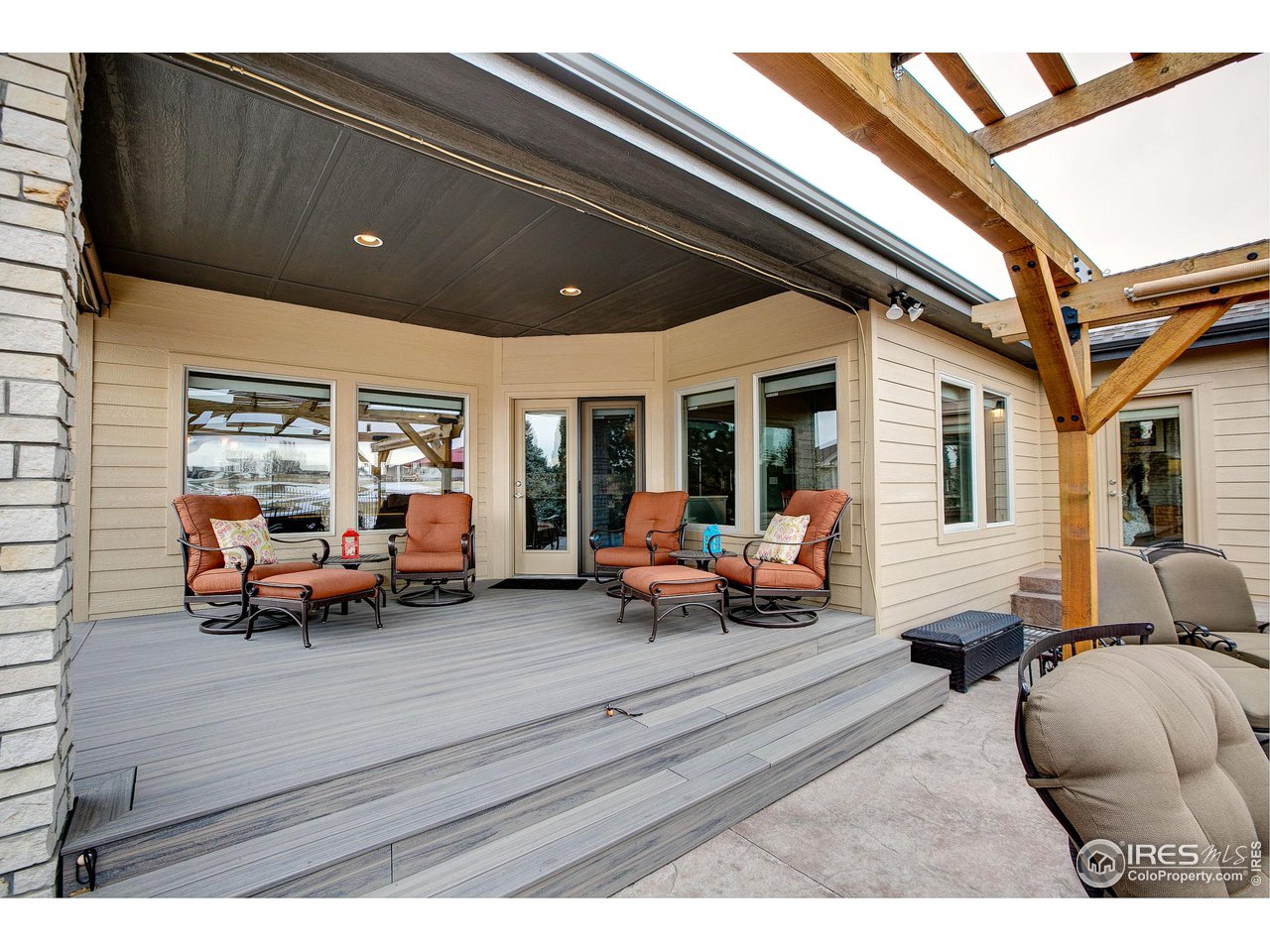 6001 Bay Meadows Drive Windsor, CO 80550 - Photo 9 of 39 Private, Covered Outdoor Living Room with Composite Decking