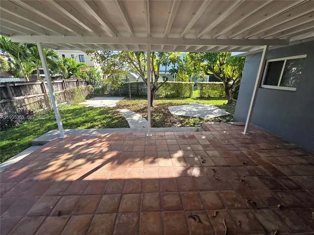 a view of backyard with green space
