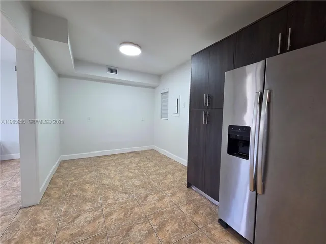 a view of a refrigerator in kitchen and a refrigerator