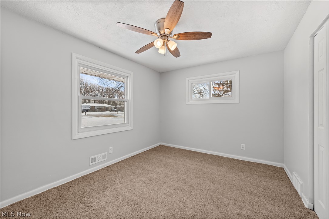 8760 Priem Road Strongsville, OH 44149 - Photo 10 of 29 Carpeted empty room featuring ceiling fan