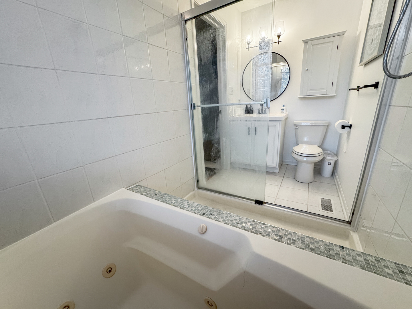 2106 West Erie Street, Unit 1E Chicago, IL 60612 - Photo 20 of 41 a bathroom with a toilet and a mirror