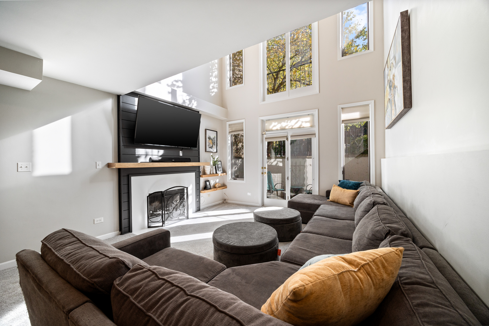 2106 West Erie Street, Unit 1E Chicago, IL 60612 - Photo 24 of 41 a living room with furniture a flat screen tv and a fireplace