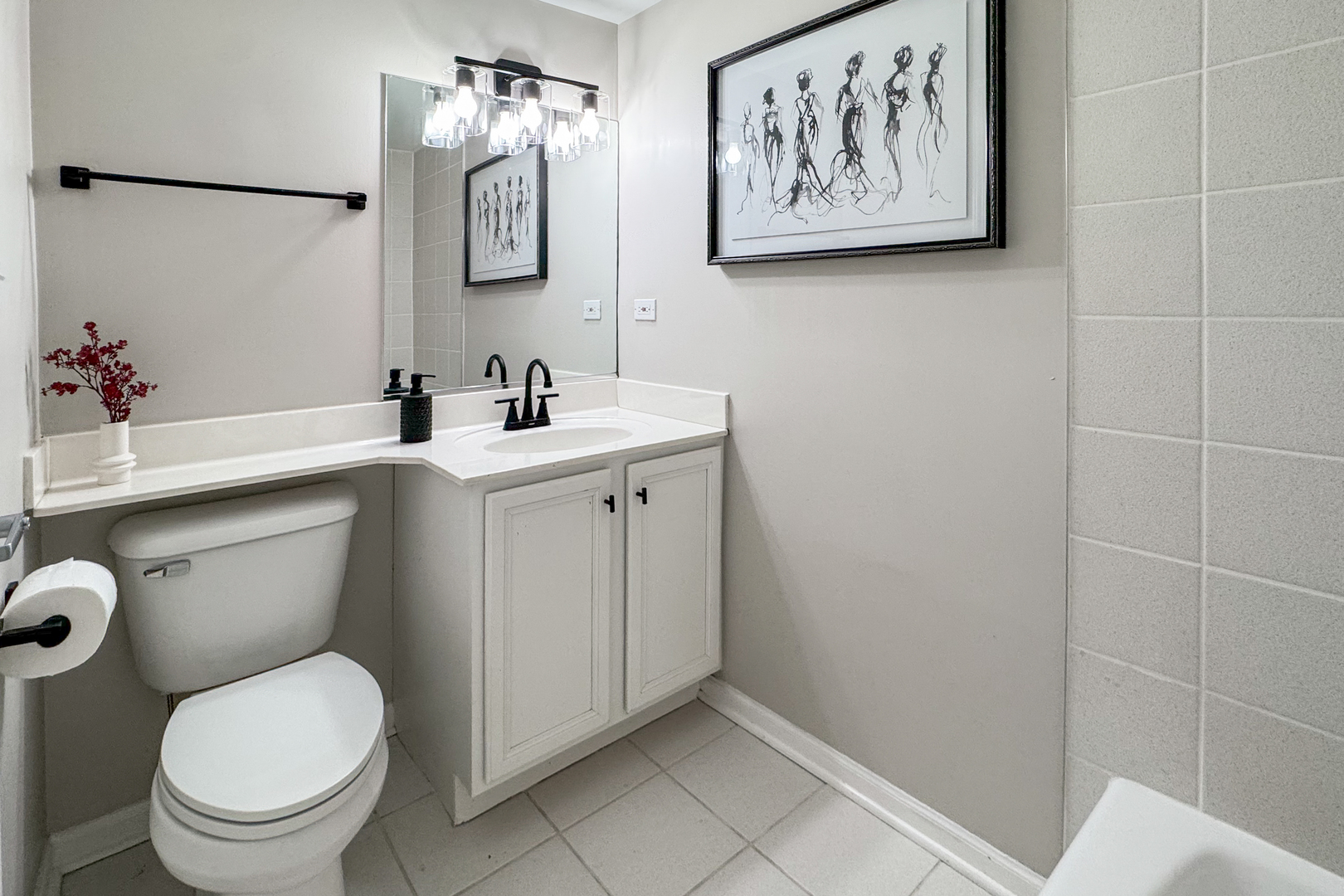 2106 West Erie Street, Unit 1E Chicago, IL 60612 - Photo 33 of 41 a bathroom with a toilet sink and mirror