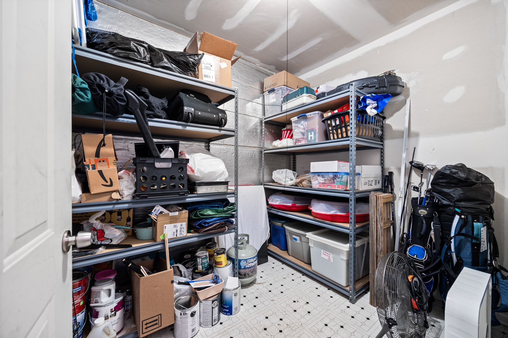 2106 West Erie Street, Unit 1E Chicago, IL 60612 - Photo 35 of 41 a view of walk in closet with clothes and shoes