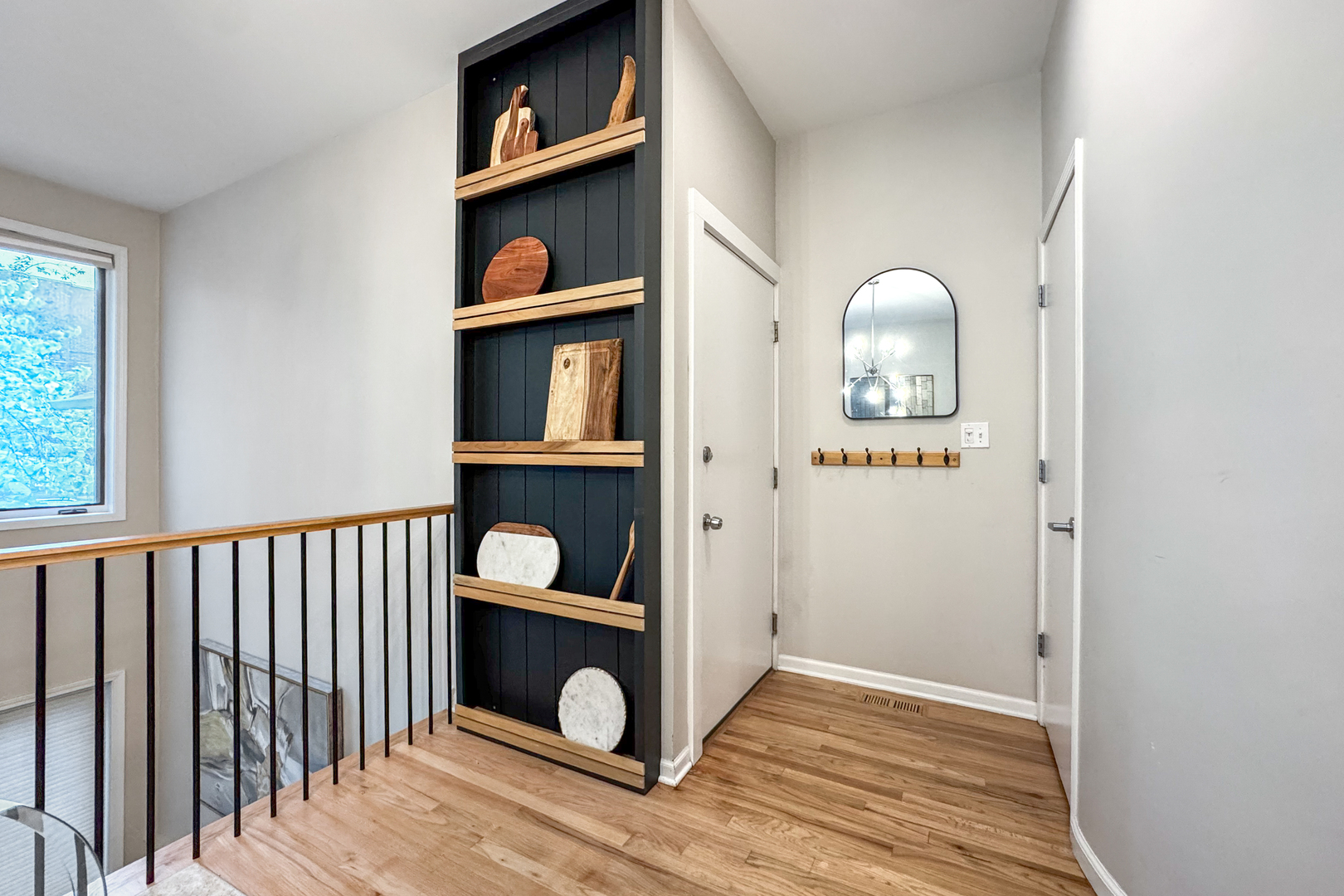 2106 West Erie Street, Unit 1E Chicago, IL 60612 - Photo 4 of 41 a view of a hallway with wooden floor and cabinets