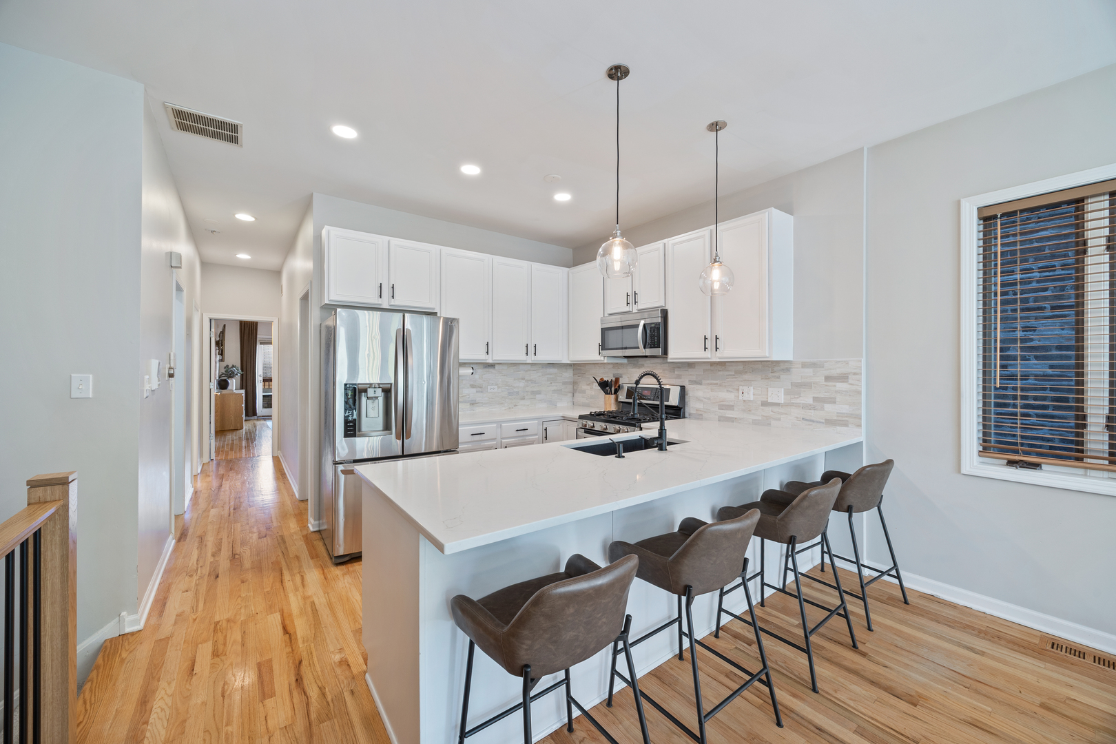 2106 West Erie Street, Unit 1E Chicago, IL 60612 - Photo 6 of 41 a large kitchen with lots of counter space and refrigerator