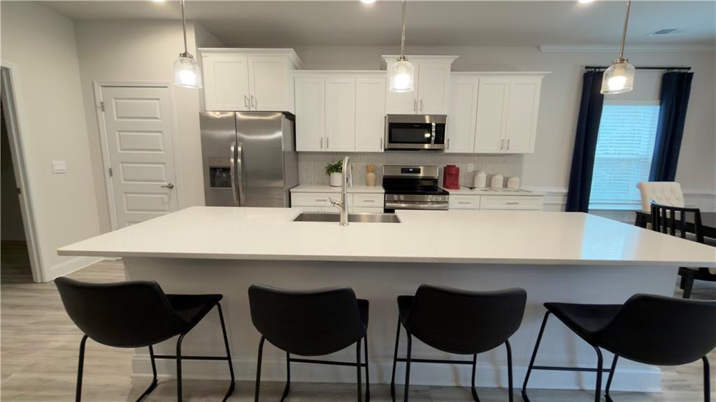 620 Bald Ridge Circle Demorest, GA 30535 - Photo 9 of 43 a kitchen with a dining table chairs and refrigerator