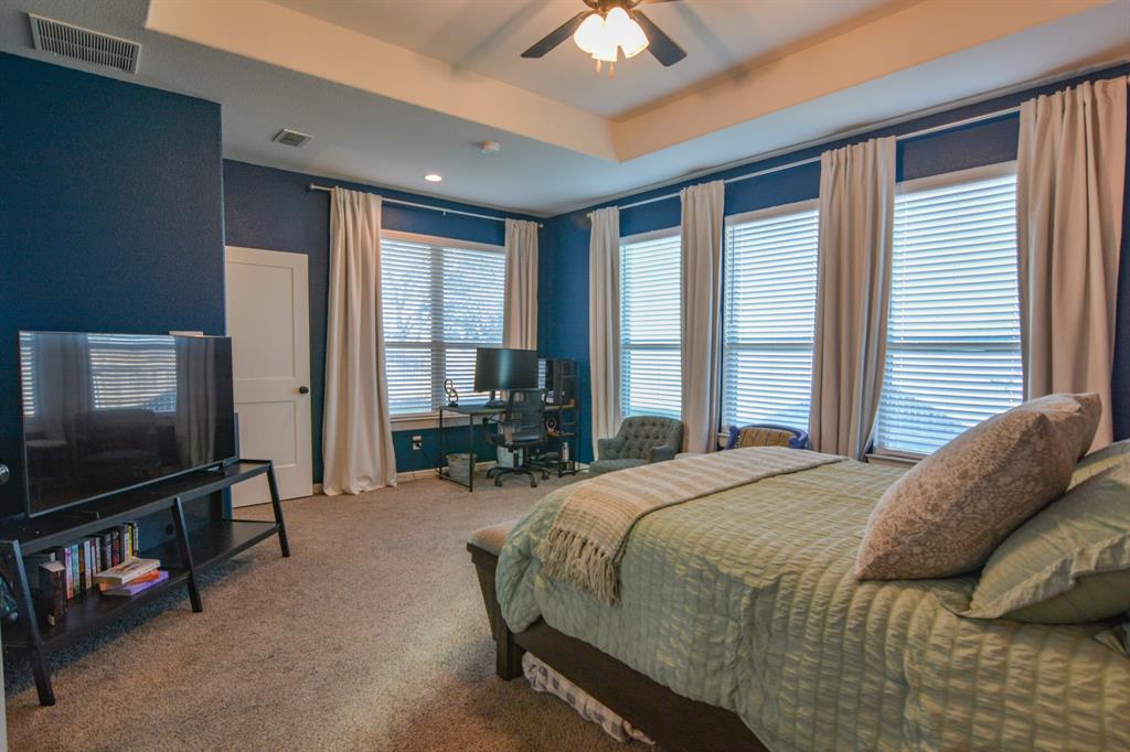601 Mathew Street Grandview, TX 76050 - Photo 21 of 40 a bed sitting in a spacious bedroom next to a window