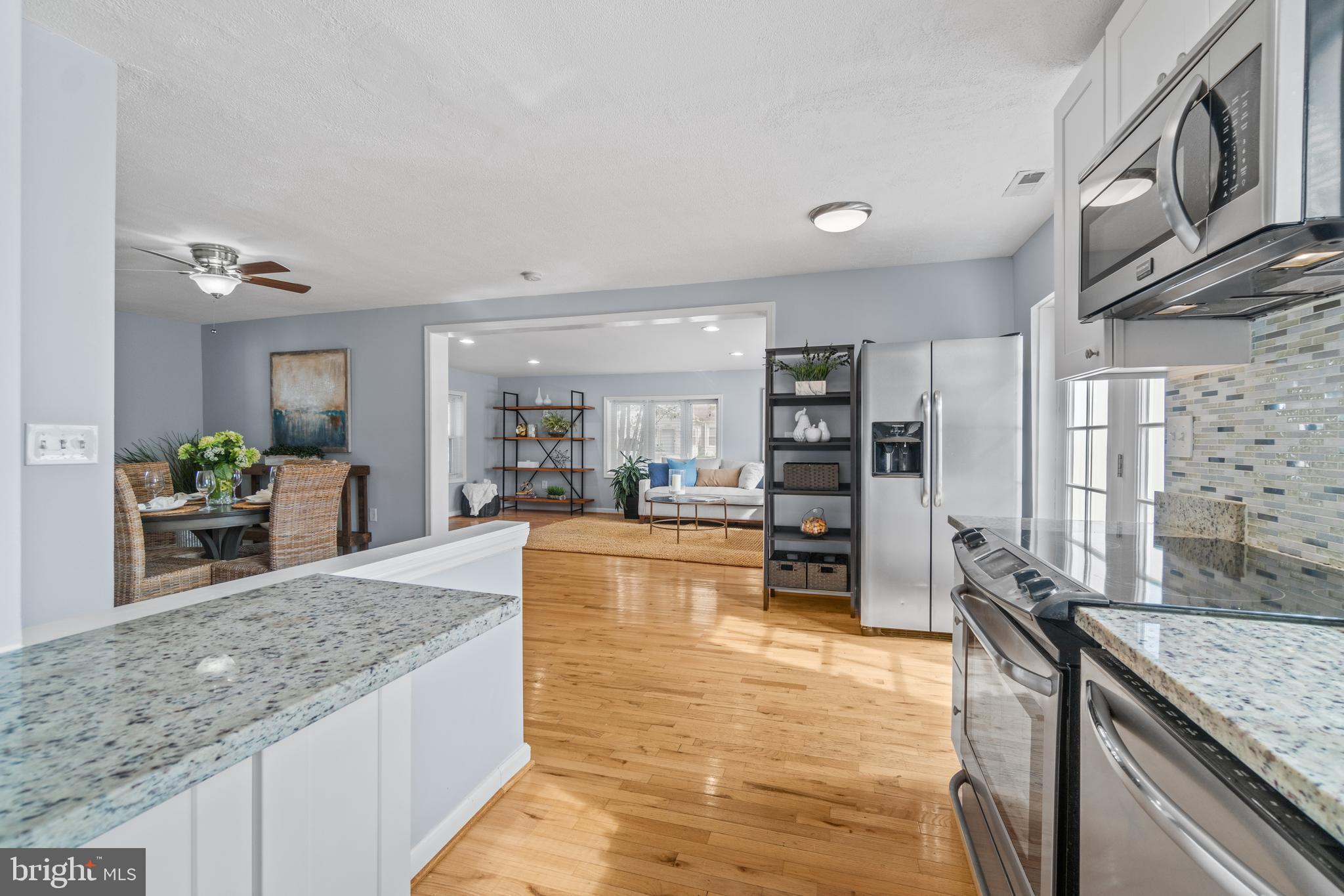 1009 Upton Road Glen Burnie, MD 21060 - Photo 11 of 31 Kitchen with granite counters & tiled backsplash