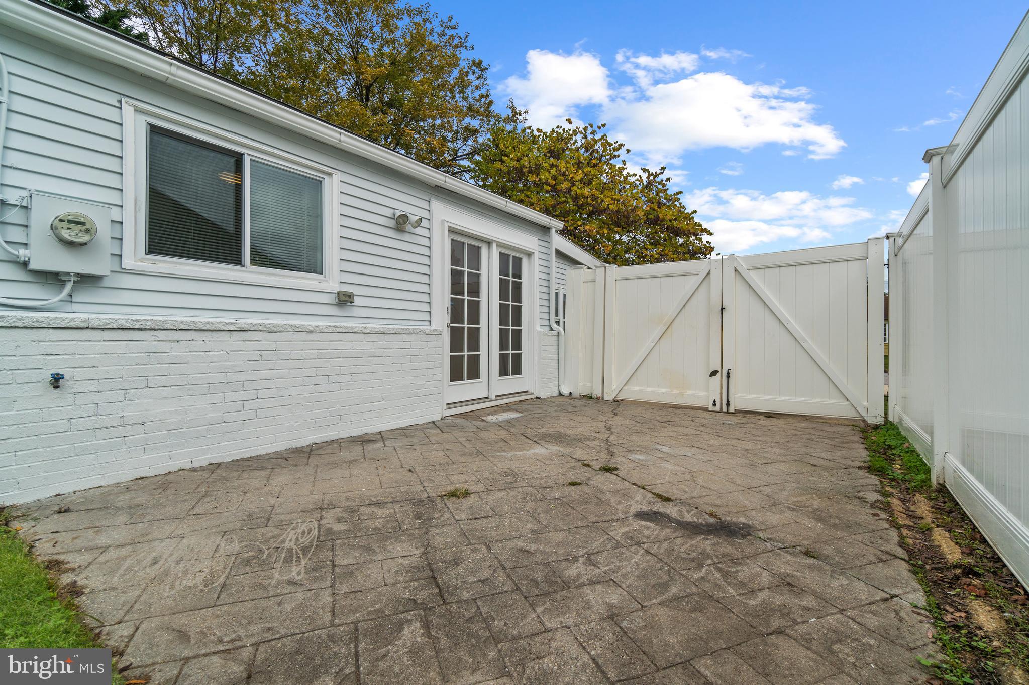 1009 Upton Road Glen Burnie, MD 21060 - Photo 25 of 31 Back patio with gate to driveway
