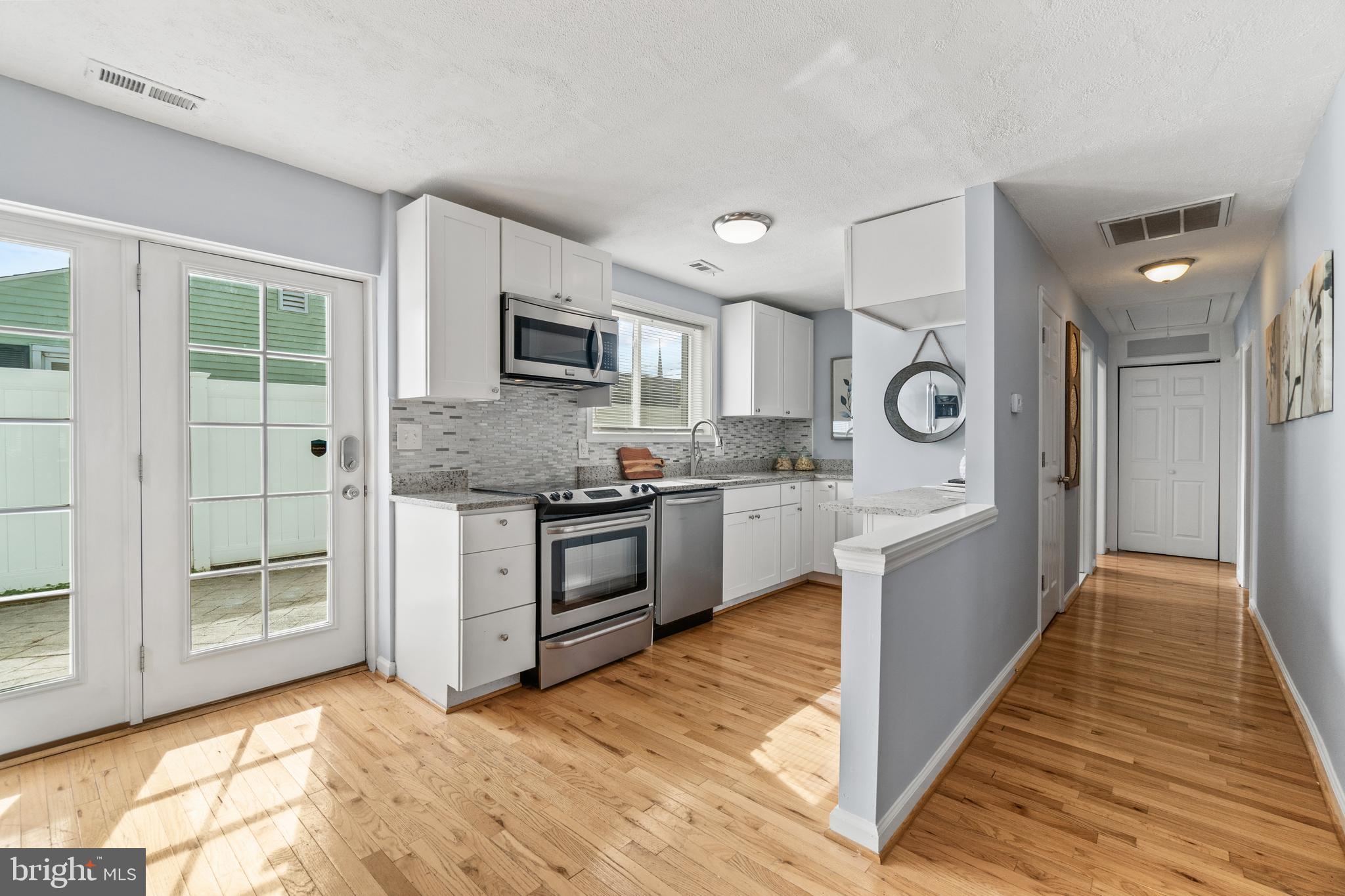 1009 Upton Road Glen Burnie, MD 21060 - Photo 9 of 31 French doors lead to back patio and fenced-in yard