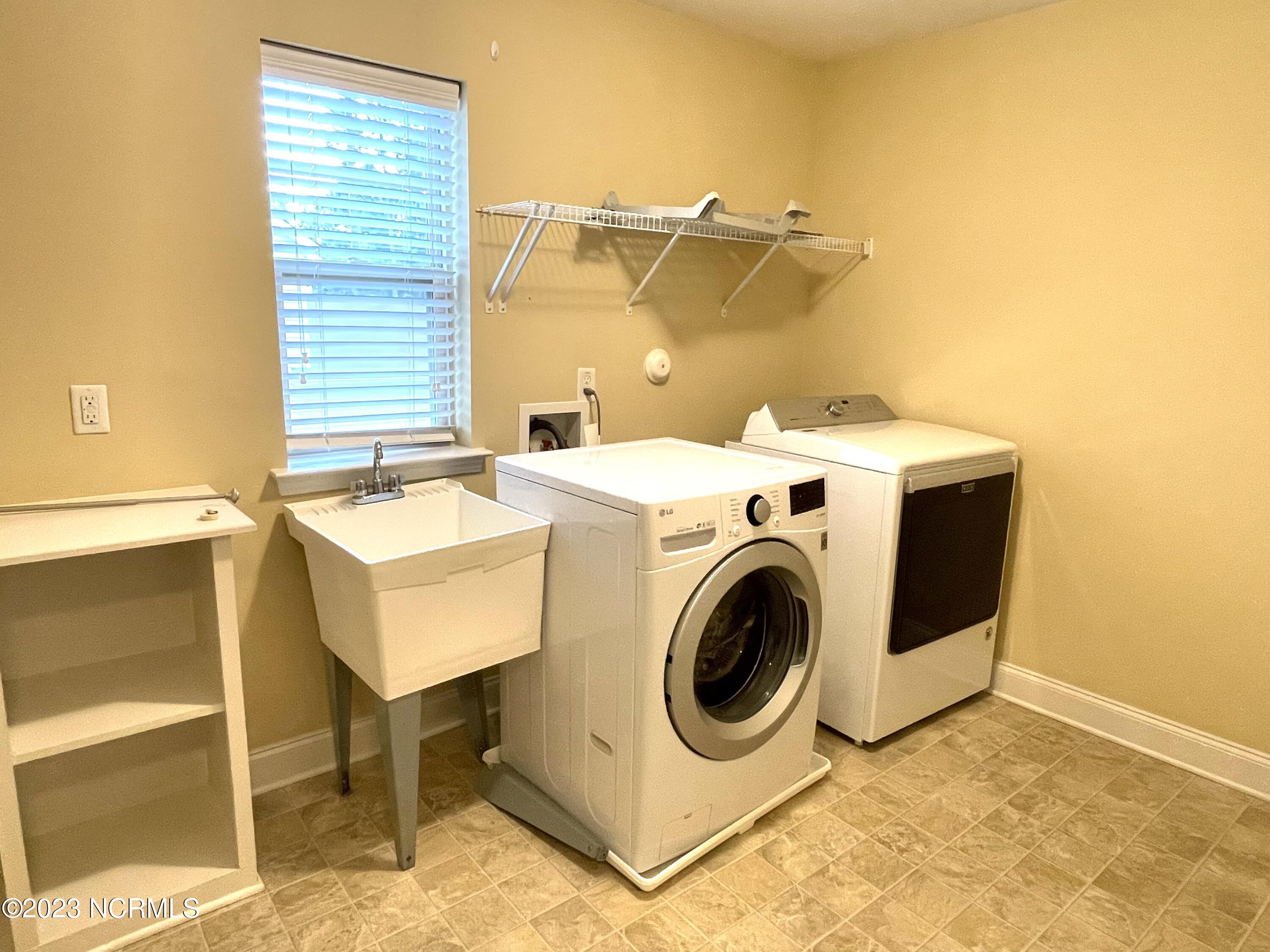 764 Sun Road Aberdeen, NC 28315 - Photo 21 of 34 Laundry Room with washer and dryer