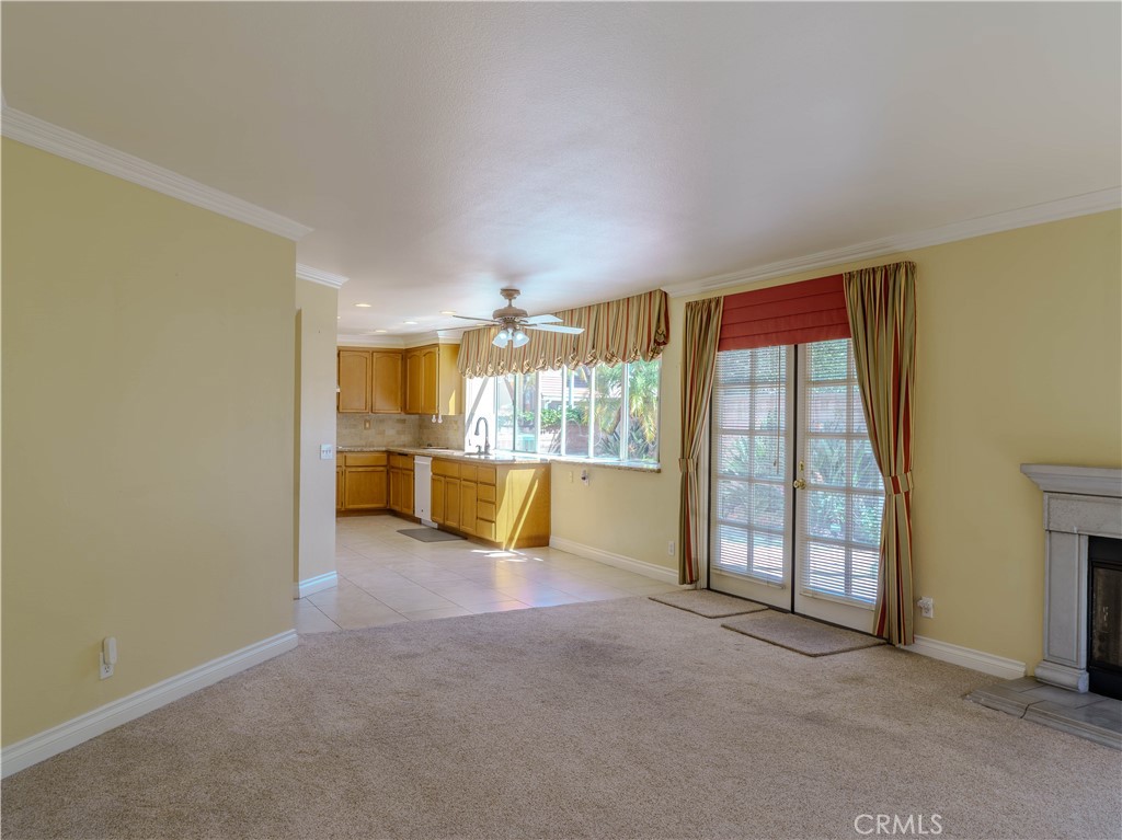 6853 Pandino Court Rancho Cucamonga, CA 91701 - Photo 11 of 44 an empty room with entrance wooden floor and windows