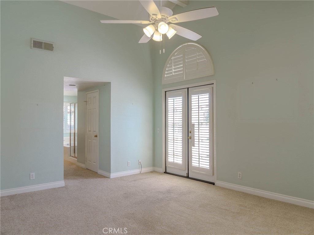 6853 Pandino Court Rancho Cucamonga, CA 91701 - Photo 19 of 44 an empty room with chandelier fan