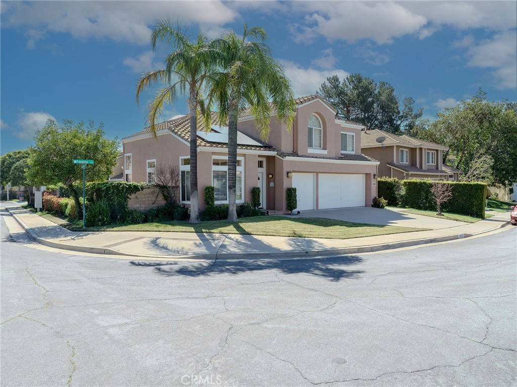 6853 Pandino Court Rancho Cucamonga, CA 91701 - Photo 2 of 44 a view of a house with swimming pool and a yard
