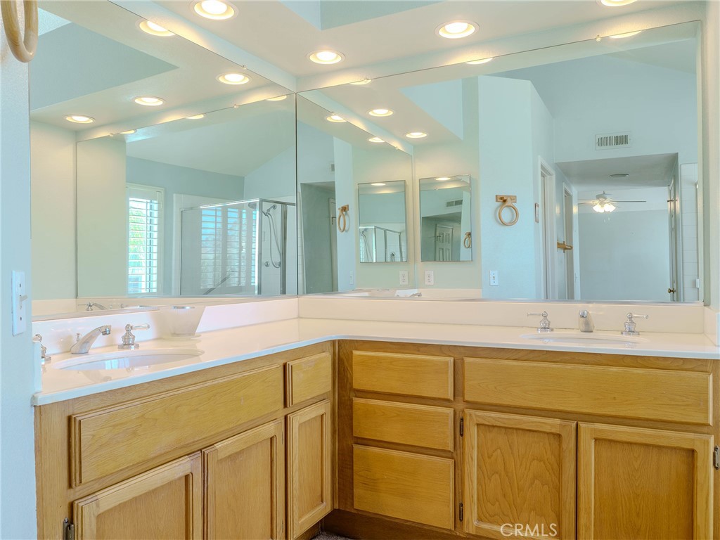 6853 Pandino Court Rancho Cucamonga, CA 91701 - Photo 21 of 44 a bathroom with a sink vanity and mirror