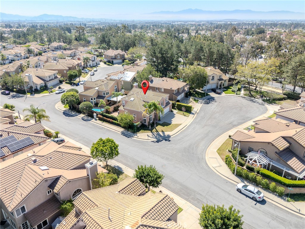 6853 Pandino Court Rancho Cucamonga, CA 91701 - Photo 34 of 44 an aerial view of a house with yard swimming pool and mountain view