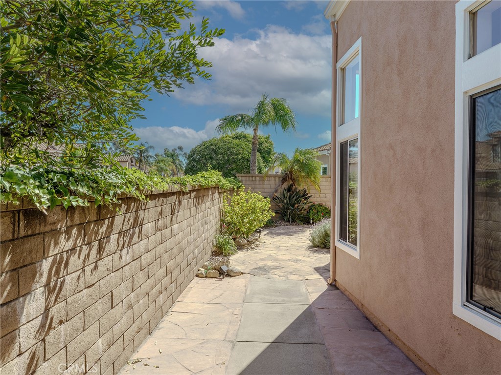 6853 Pandino Court Rancho Cucamonga, CA 91701 - Photo 39 of 44 a view of a pathway with a yard