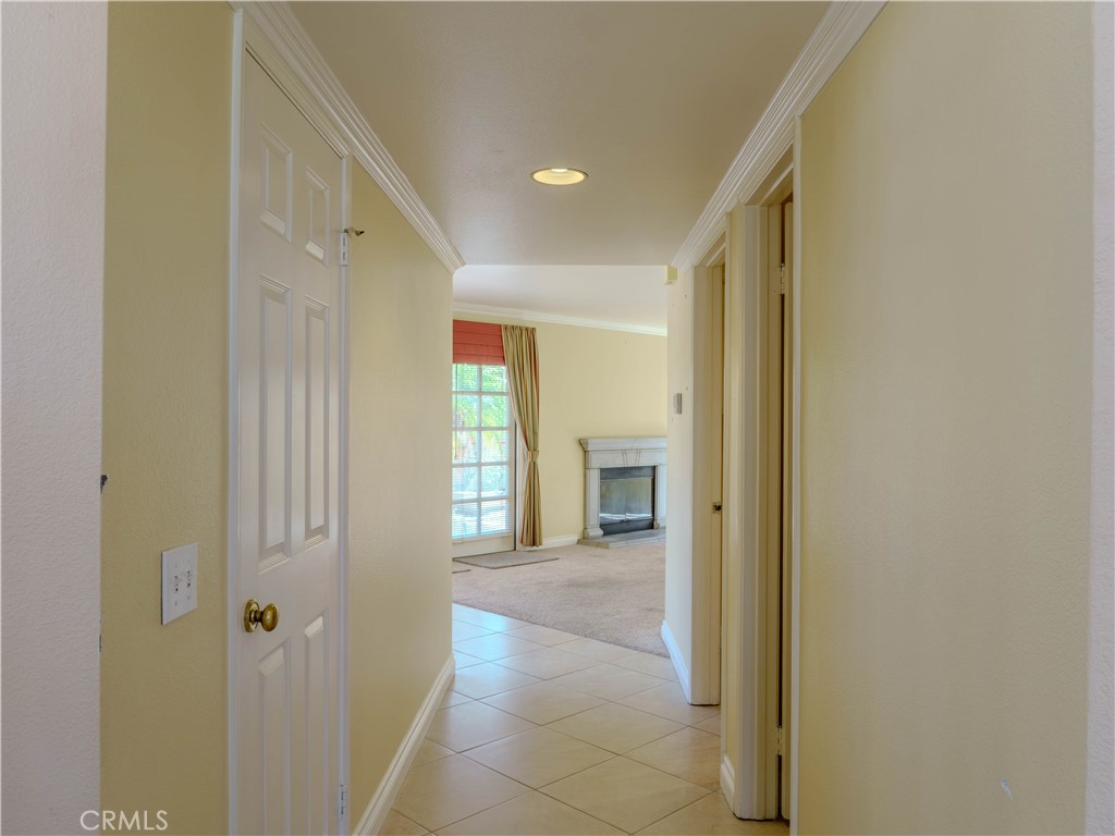 6853 Pandino Court Rancho Cucamonga, CA 91701 - Photo 9 of 44 a view of a hallway with a bathroom