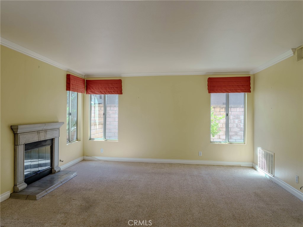 6853 Pandino Court Rancho Cucamonga, CA 91701 - Photo 10 of 44 a view of empty room with a fireplace