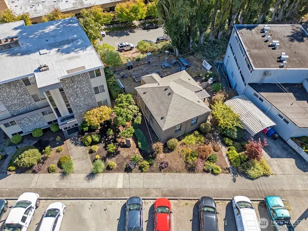 an aerial view of a house with a yard and garden