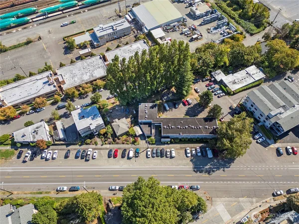 an aerial view of a building with outdoor seating